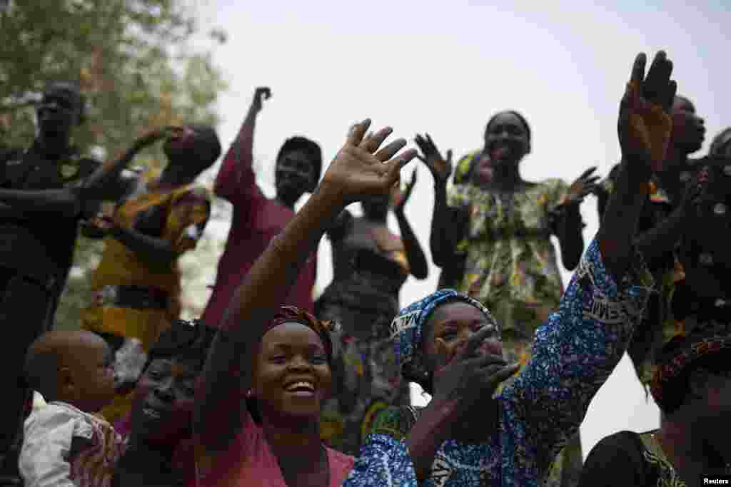 People react to a speech given by Alexandre Nguendet, the head of Central African Republic's transitional assembly in Bangui, Jan. 13, 2014.