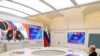 Russian President Vladimir Putin listens leaders from the BRICS group of emerging economies at the start of a three-day summit in Johannesburg, South Africa via videoconference from Moscow, Aug. 22, 2023.