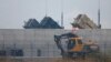 A truck moves past U.S. Army Patriot missile air defense artillery batteries at U.S. Osan air base in Osan, south of Seoul, April 5, 2013. 