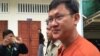 Mr. Ny Chakrya is being escorted by police out of the appeals court in Phnom Penh, August 8, 2016. (Kann Vicheika/VOA Khmer)