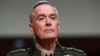 FILE - Joint Chiefs Chairman Gen. Joseph Dunford on Capitol Hill in Washington, June 13, 2017. Military chiefs will seek a six-month delay before letting transgender people enlist in their services, officials said June 23. Dunford told a Senate committee there have been some issues identified with recruiting transgender individuals that “some of the service chiefs believe need to be resolved before we move forward.” 