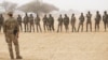 FILE - A U.S. Army Special Forces weapons sergeant speaks to a group of Nigerien soldiers during Exercise Flintlock 2017 in Diffa, Niger, March 11, 2017. A fourth U.S. soldier was killed during an attack this week in Niger, according to the U.S. military.