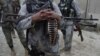 FILE - Afghan security forces guard a checkpoint in Spein Boldak at the border with Pakistan, Kandahar province, Afghanistan, Jan. 25, 2016, after three Taliban gunmen killed Afghan General Khan Agha in the Dand districty.