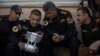 FILE - Iraqi special forces Lt. General Abdul-Wahab al-Saadi, center, looks at a live video feed from a drone flying over Islamic State militant-held territory as they advance their position in Mosul, Iraq, Nov. 18, 2016.