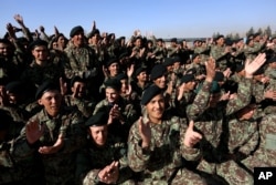 New members of the Afghan National Army attend their graduation ceremony at the Afghan Military Academy in Kabul, Afghanistan, Jan, 24, 2016.