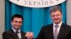 Ukraina prezidenti Petro Poroshenko (o'ngda) Andrey Deshitsa o'rniga tayinlangan yangi Tashqi ishlar vaziri Pavel Klimkin bilan, Kiyev, 19-iyun, 2014-yil.