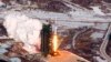 A video grab from KCNA shows the Unha-3 (Milky Way 3) rocket launching at North Korea's West Sea Satellite Launch Site, at the satellite control center in Cholsan county, North Pyongang province, Dec. 13, 2012.