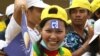 Kem Sokha, left, and Sam Rainsy at a campaign rally in Kampong Cham province. 