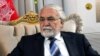FILE - Sayed Fazlullah Wahidi, former governor of Afghanistan’s western Herat province, arrived in Islamabad, Pakistan with his family to apply for a visa to visit Britain.