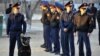 Police stand guard outside a court where defendants accused of participating in December's clashes that killed at least 14 people are on trial in the Caspian port city of Aktau March 28, 2012. Last year's violence in west Kazakhstan has posed the most ser