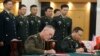 U.S. Chairman of the Joint Chiefs of Staff Joseph Dunford and his Chinese counterpart, chief of the general staff of the Chinese People's Liberation Army Gen. Fang Fenghui, attend a signing ceremony in Beijing, China, Aug. 15, 2017.