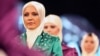 Models wear creations by a Turkish Islamic fashion house for its spring-summer 2008 ready-to-wear collection in Ankara, Turkey, Monday, March 3, 2008.