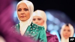 Models wear creations by a Turkish Islamic fashion house for its spring-summer 2008 ready-to-wear collection in Ankara, Turkey, Monday, March 3, 2008.