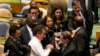 Cuba's Foreign Minister Bruno Rodriguez, center right, is congratulated by fellow U.N. delegates after a vote on the annual draft resolution calling for an end to the U.S.-led five-decade embargo against the Caribbean nation, in the United Nations General