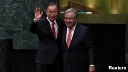 United Nations Secretary-General Ban Ki-moon (left) and Secretary-General-designate Antonio Guterres stand together after the swearing-in ceremony at U.N. headquarters in New York, Dec. 12, 2016. 