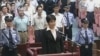 China Death Sentence: FILE - Gu Kailai, center in front, the wife of disgraced politician Bo Xilai, listens to the verdict during her trial at Hefei Intermediate People's Court in the eastern Chinese city of Hefei Monday, Aug. 20, 2012. Gu received a suspended death sentence.