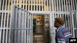 An Iranian man visits on Sept. 2, 2014 the "Qasr prison," a former prison hosting political prisoners that was turned into a museum in 2012 in the Iranian capital Tehran. 