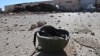 A youth works at a makeshift oil refinery in Syria that, according to its owner, gets crude oil from Islamic State-controlled areas of Syria and Iraq.