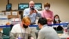 FILE - Observers from each major party watch as Lehigh County workers count ballots for a general election in Allentown, Pa., Nov. 6, 2020. 