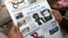 FILE - An Afghan man reads a local newspaper carrying a headline about the new leader of the Afghan Taliban, Mullah Akhtar Mansoor, in Kabul, Afghanistan, Aug. 1, 2015.