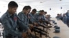 FILE - Afghan security forces practice handling their weapons in Lashkargah, capital of the southern Helmand province, July 23, 2016. More than 900 reportedly were killed that month alone in heavy fighting against Taliban insurgents. 