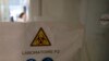 French lab scientist working in a lab at Pasteur Institute in Paris using genetic information about the coronavirus to develop a potential vaccine and treatments, Feb. 6, 2020
