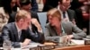 Britain's U.N. Ambassador Matthew Rycroft, left, and United States U.N. Ambassador Samantha Power, right, confer during a Security Council meeting on terrorism, May 11, 2016, at U. N. headquarters in New York.