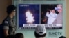 A South Korean army soldier watches a TV news program showing images published Thursday in North Korea's Rodong Sinmun newspaper of North Korea's ballistic missile launch and North Korean leader Kim Jong-un, at Seoul Railway station in Seoul, South Korea, Aug. 25, 2016.