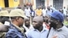 Uganda's main opposition leader Kizza Besigye (3rd L) and his supporters are blocked by policemen during a 'walk-to-work' protest in Kasangati suburb near Uganda's capital Kampala, (file photo)