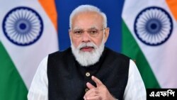 ইন্ডিয়ান প্রেস ইনফরমেশন ব্যুরো (পিআইবি) কর্তৃক প্রকাশিত এই ছবিটি ভারতের প্রধানমন্ত্রী নরেন্দ্র মোদী নতুন দিল্লিতে আফগানিস্তানের উপর একটি ভার্চুয়াল জি ২০ এক্সট্রাঅর্ডিনারি সামিটে অংশ নেওয়ার সময় কথা বলছেন।