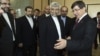 Turkey's Foreign Minister Ahmet Davutoglu [R] welcomes Iran's chief negotiator Saeed Jalili [2nd R] before their meeting in Istanbul, April 14, 2012.