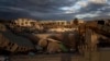Buildings destroyed in the Bab al-Aziziya compound and an occupied intact building in Tripoli, Libya Nov. 26, 2013 (AP Photo/Manu Brabo)