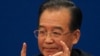 Chinese Premier Wen Jiabao gestures as he answers questions during a press conference after the closing session of the annual National People's Congress in Beijing's Great Hall of the People, China, Monday, March 14, 2011. (AP Photo/Ng Han Guan)