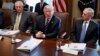 President Donald Trump speaks during a cabinet meeting at the White House as Secretary of State Rex Tillerson, left, and Secretary of Defense Jim Mattis, right, listen, Oct. 16, 2017.