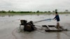 A Thai farmer plows his rice field in Ayutthaya province, central Thailand, June 21, 2013. 