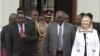 Kenya's President Mwai Kibaki (C), flanked by U.S. Secretary of State Hillary Clinton (R) and his vice president Kalonzo Musyoka (L), leaves after a meeting at State House in Nairobi August 4, 2012. 