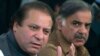 FILE - In this Feb. 17, 2008 file photo, Pakistan's Prime Minister Nawaz Sharif, left, and his brother Shahbaz Sharif address a news conference in Lahore, Pakistan. Sharif has announced that he will set up an independent judicial commission to probe whether his family is involved in illegal overseas investments after reports based on documents leaked from a Panama-based law firm indicated his sons owned several offshore companies.