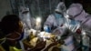 Petugas medis mengambil sampel rapid test dari pedagang di pasar tradisional untuk mencegah penyebaran virus Covid-19 di Semarang, Jawa Tengah, 22 Mei 2020. (Antara Foto/Aji Styawan/ via REUTERS)