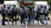 Netherlands' special intervention police officers gather at the Erasmus University Medical Center (Erasmus MC) in Rotterdam on September 28, 2023, which was cordoned off after two reported shooting incidents.