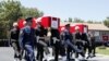 Turkish soldiers carry the coffins of fallen Turkish pilots, Captain Gokhan Ertan and Lieutenant Hasan Huseyin Aksoy, during an official farewell ceremony at the 7th Jet Main Air Base in the eastern Turkish city of Malatya July 6, 2012.