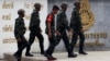 Thai Army officers walk outside the military barracks believed to be holding two arrested bomb suspects involved in the recent Bangkok blast in Bangkok, Thailand, September 2, 2015.