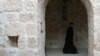 A Syriac Christian monk walks to attend a service at the ancient monastery of Mor Gabriel, 15 km from the town of Midyat, southeastern Turkey on Jan. 13, 2009.