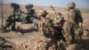 FILE - U.S. soldiers with Task Force Iron maneuver an M-777 howitzer so it can be towed into position at Bost Airfield, Afghanistan, June 10, 2017. (Operation Resolute Support)