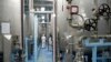 FILE - A technician is seen at the uranium conversion facility in Isfahan, 450 kilometers south of Tehran, Feb. 3, 2007. The Isfahan nuclear research center is already home to three reactors.