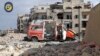 In this photo provided by the Syrian Civil Defense group known as the "White Helmets," a destroyed ambulance is seen outside the Syrian Civil Defense main center after airstrikes in Ansari neighborhood in the rebel-held part of eastern Aleppo, Syria, Sept