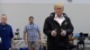 FILE - President Donald Trump gives a thumbs up after meeting people impacted by Hurricane Harvey during a visit to Houston, Texas, Sept. 2, 2017.