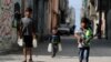 Palestinian boys carry bottles of water in Al-Shati refugee camp in Gaza City, Oct. 23, 2019. 
