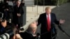 FILE - President Donald Trump speaks to reporters on the South Lawn of the White House, in Washington, Nov. 29, 2018.