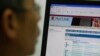 Ma Ngok, an associate professor in the Department of Government and Public Administration at the Chinese University of Hong Kong browses his webmail at the university in Hong Kong, June 13, 2013.e