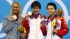 Elizabeth Beisel (L) of the U.S. and China's Ye Shiwen and Ye's compatriot Li Xuanxu stand with their silver, gold and bronze medals for the women's 400m individual medley during the London 2012 Olympic Games at the Aquatics Centre July 28, 2012. 